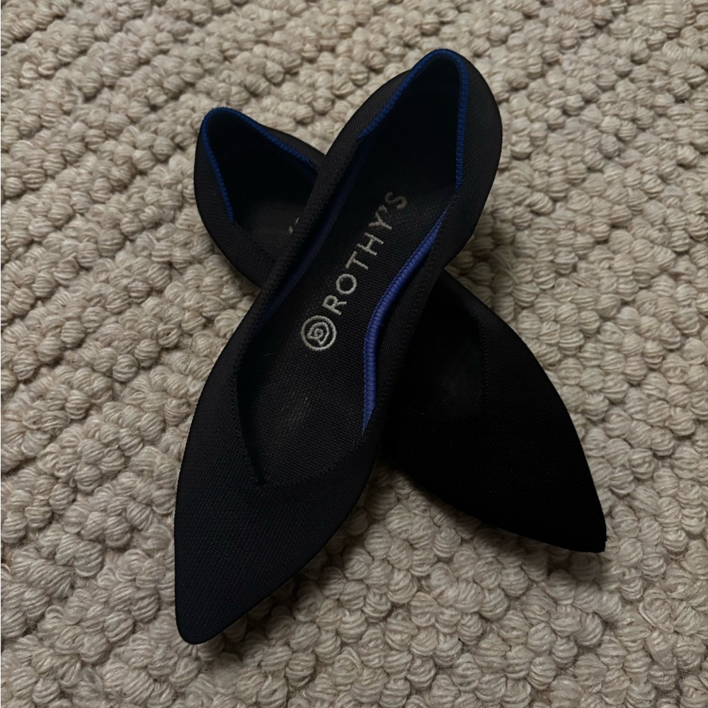 Rothy's Elegant Black Flats with Vibrant Blue Accent